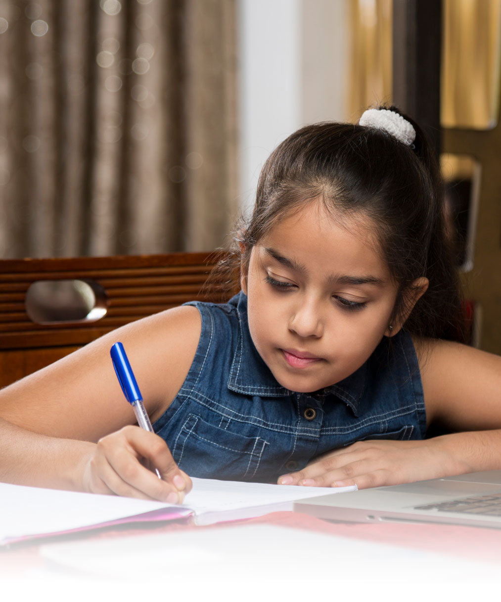 Image of young boy being tutored and doing SEA Lessons at PTI in East Trinidad Arima